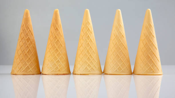 istock Empty waffle cups on a white background. Preparation for desserts and ice cream 1185765441