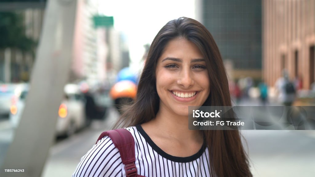 Portrait of a teenager girl in an avenue Teenager Stock Photo