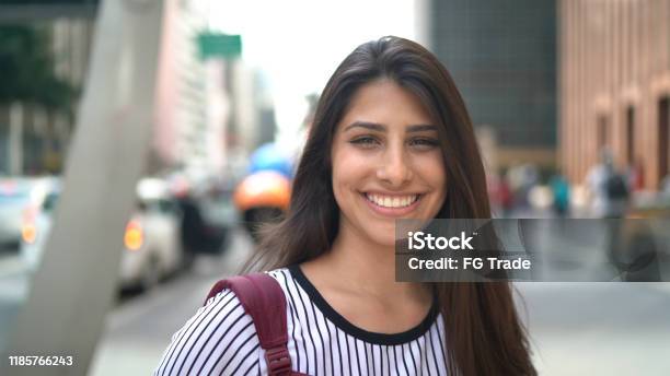 Portrait Of A Teenager Girl In An Avenue Stock Photo - Download Image Now - Teenager, Smiling, Adolescence
