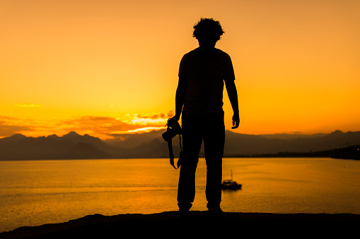 Silhouette Of Photographer In Sunset