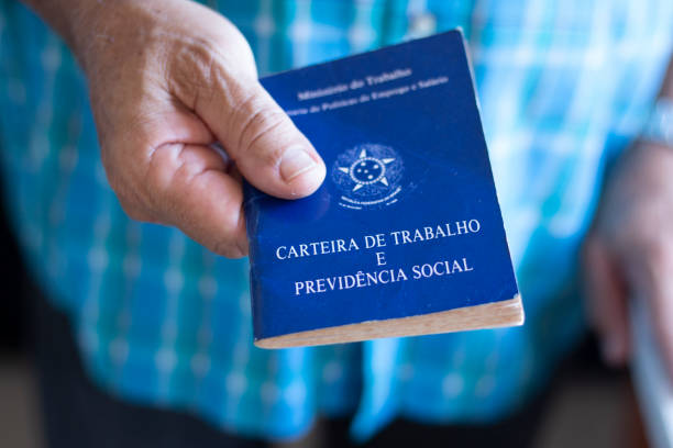 istock Man holding with hands Brazilian document work and social security 1185769175