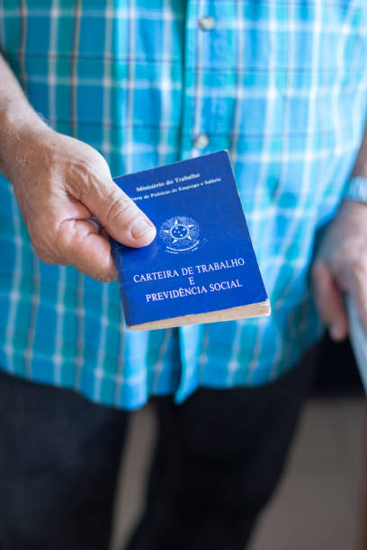 istock Man holding with hands Brazilian document work and social security 1185769205
