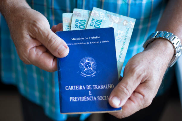 istock Man holding with hands Brazilian document work and social security 1185769212
