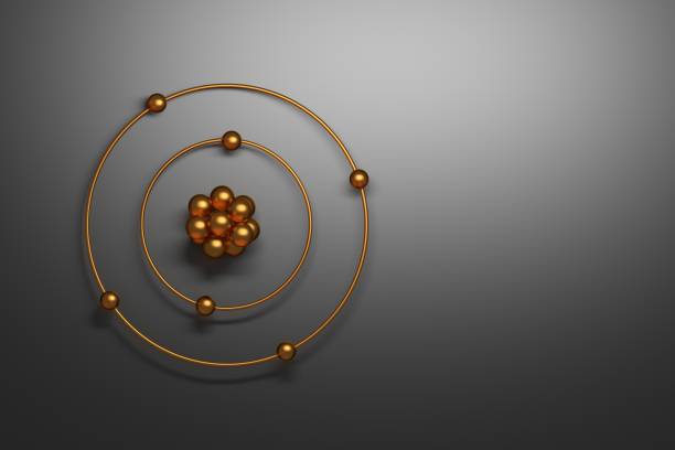 Golden carbon atom on gray backgound Carbon atom simplistic representation with golden nucleus, orbitals and electrons on black gray background. 3d illustration. nuclear energy stock pictures, royalty-free photos & images