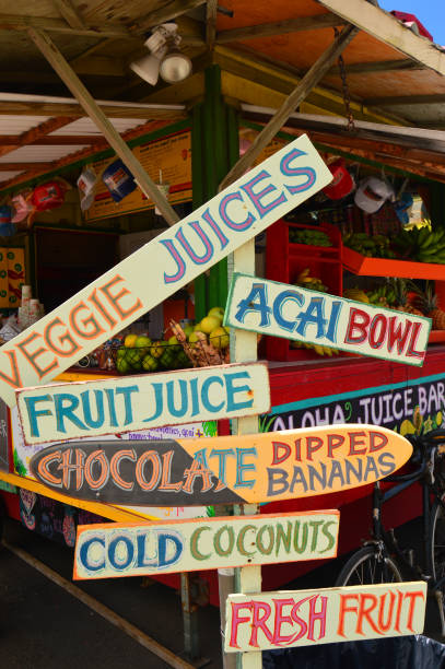 Hanalei, HI, USA August 4, 2014 An organic tropical fruit stand in Hanalei, Hawaii, uses hand painted signs to promote their specialties