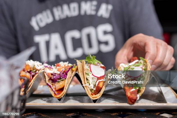 Person Eating Tacos Stock Photo - Download Image Now - Taco, Eating, Mexican Food