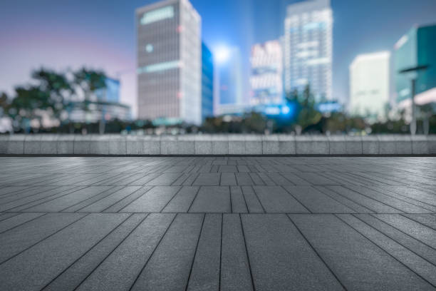 istock night view of empty brick floor front of modern building 1185771178