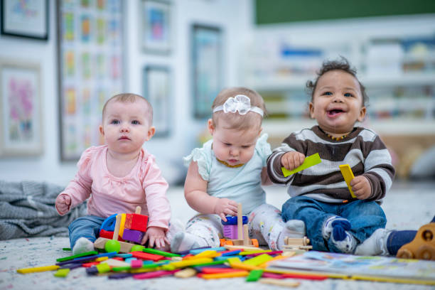 istock Babies Sitting in a Row stock photo 1185773815