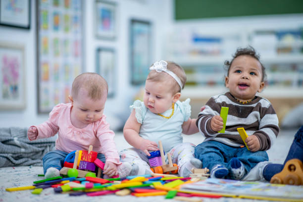 istock Babies Sitting in a Row stock photo 1185773825