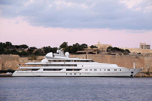 super yacht in a marina stock photo