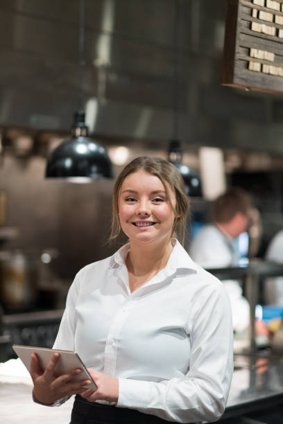 istock Portrait of a confident female restaurant manager 1185774585