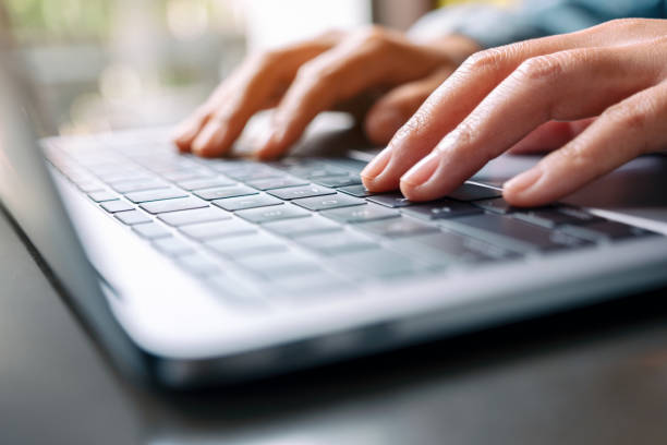 istock a woman working and typing on laptop computer on the table 1185778255