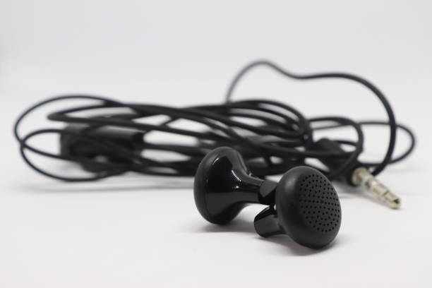 istock Black Color Earphones Isolated on White background 1185780312