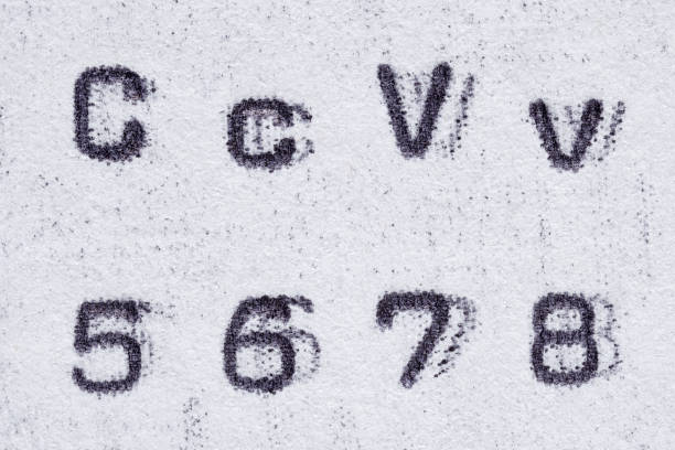 istock Real typewriter font alphabet with letters C, V, and digits 5, 6, 7, 8 1185781448