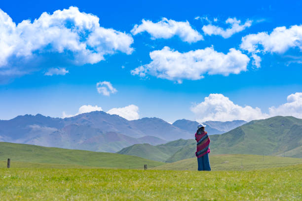 a teenager walking on the grass