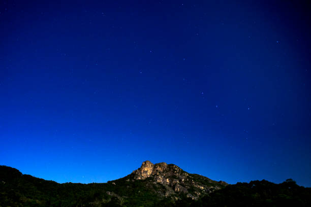 Starry Sky with Lion Rock Starry Sky with Lion Rock, is a mountain in Hong Kong stars in your eyes stock pictures, royalty-free photos & images