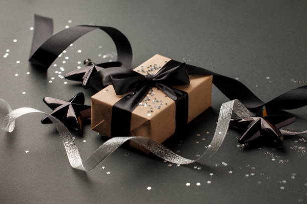istock Christmas silver decor and handmade gift box on black background top view. Merry Christmas greeting card, frame. Winter xmas holiday theme. Happy New Year. Sale 1185783362