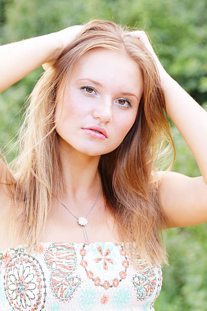 istock Fairhaired woman hands over head 118578403