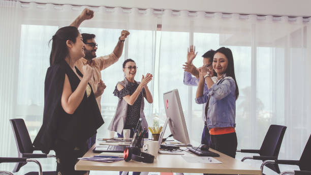 istock Successful business people celebrating success. 1185788842