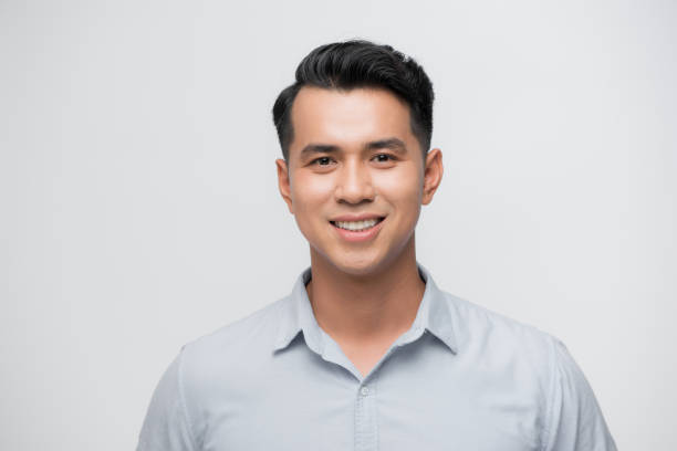 istock Young good looking asian business man on a white background isolated 1185795614