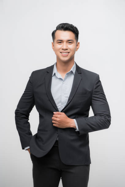 istock Young good looking asian business man on a white background isolated 1185796258