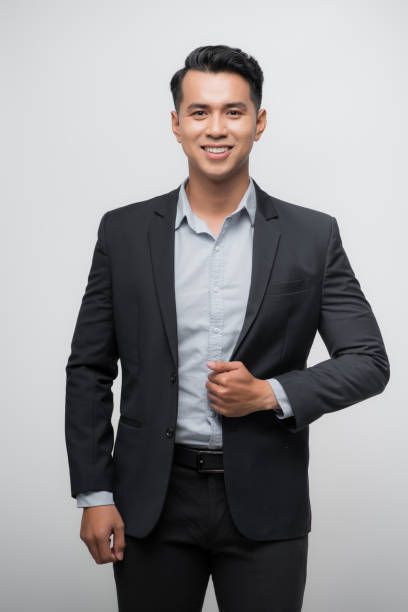 istock Confident Asian businessman smiling and looking at the camera 1185796302