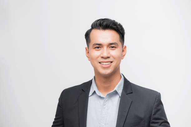 istock Confident Asian businessman smiling and looking at the camera 1185796831