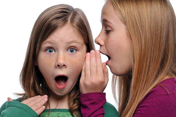 istock Two girls telling a secret 118579699