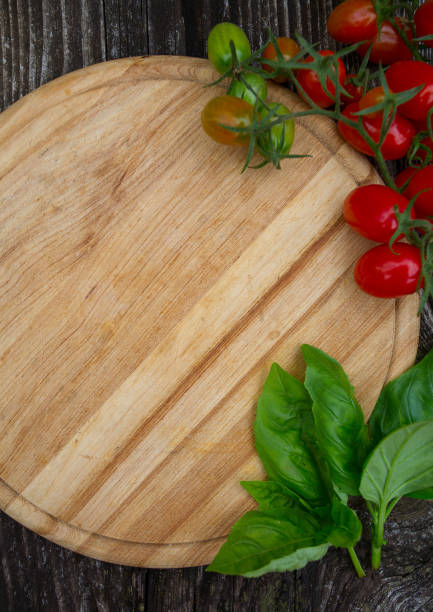 istock beautiful tomatoes on wooden surface 1185797003