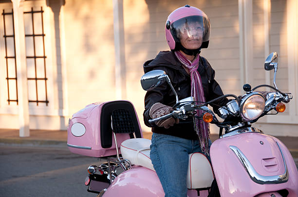 3d illustration of a young woman standing on a paved courtyard leaning on a motorcycle.