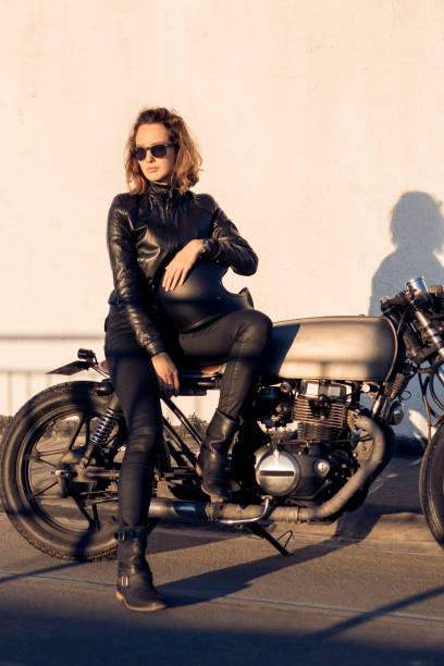 istock Biker girl on caferacer motorcycle. 1185798031