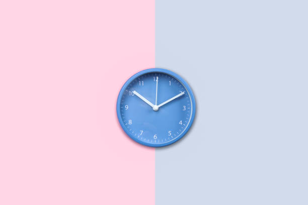 istock Blue round clock on colorful background 1185811861