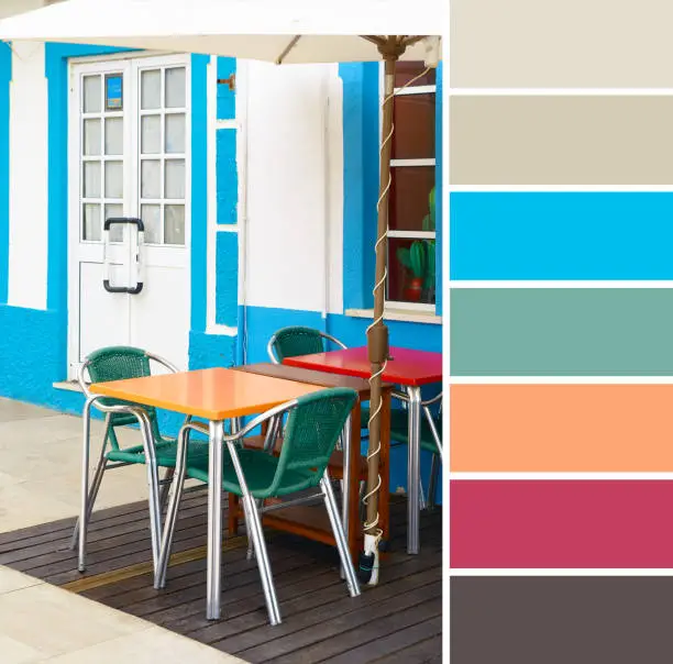 Color matching palette from travel background image of summer tables and chairs outdoors in a local restaurant in Albufeira, South Portugal, typical Mediterranean cafe.