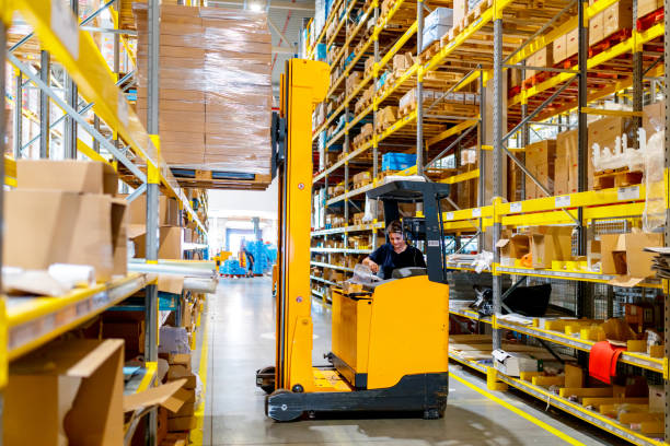 istock Female forklift driver in warehouse 1185820791
