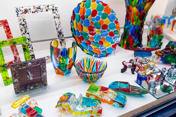 murano glass products in souvenir shop in venice - murano imagens e fotografias de stock