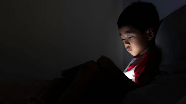 istock Asian boys are watching social media on tablets. 1185831201