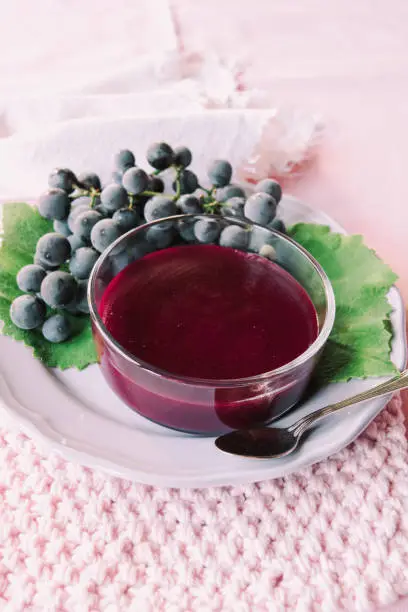 red grape pudding with cooked must in a glass cup