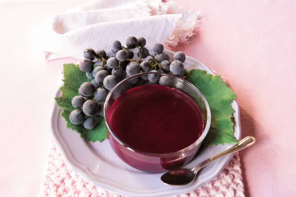 grape pudding with cooked must in a glass cup view from above