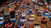 istock Blurred zoom image of traffic jam in the city at night 1185832409