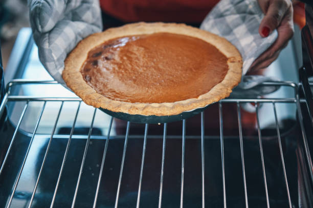 istock Baking Pumpkin Pie for the Holidays in the Oven 1185834491