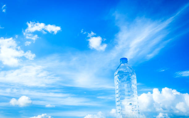istock Bottled drinking water against blue sky and cloud 001 1185834721