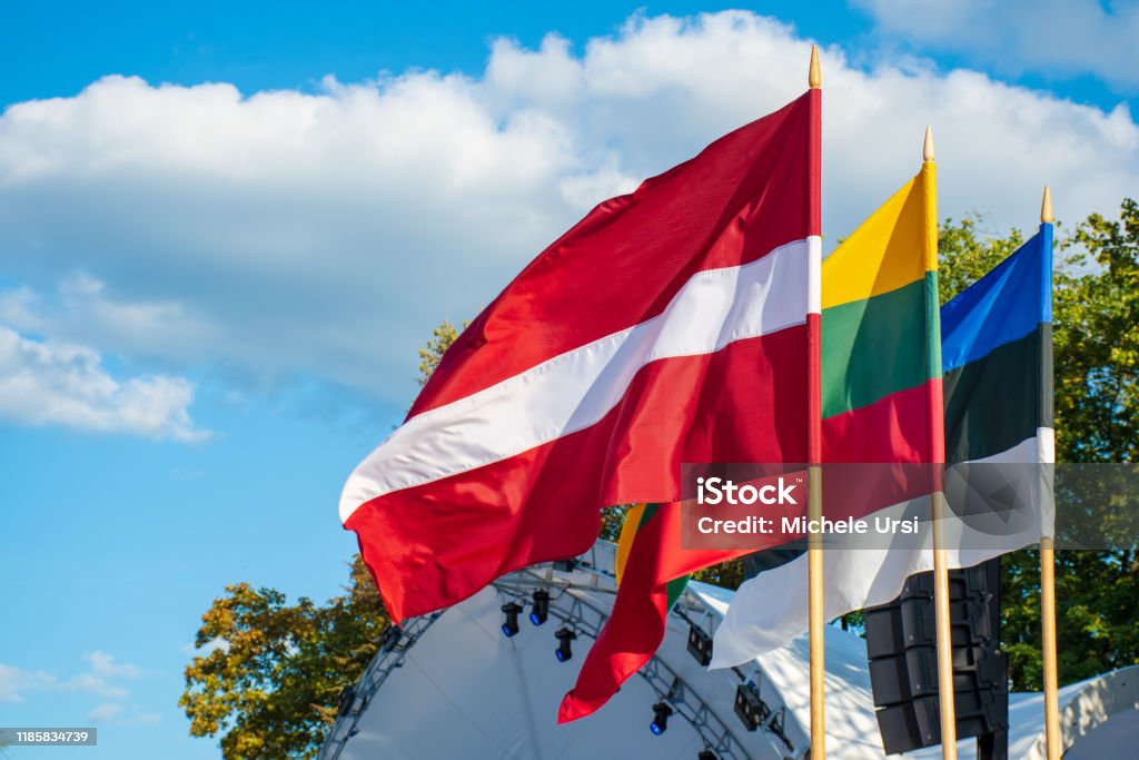 Latvian, Lithuanian and Estonian flags waving together, Latvia, Lithuania, Estonia, Baltic countries Latvian, Lithuanian and Estonian flags waving together, Latvia, Lithuania, Estonia, Baltic countries, united, independent Agreement Stock Photo