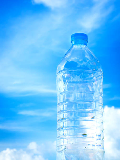 istock Bottled drinking water against blue sky and cloud 003 1185834756