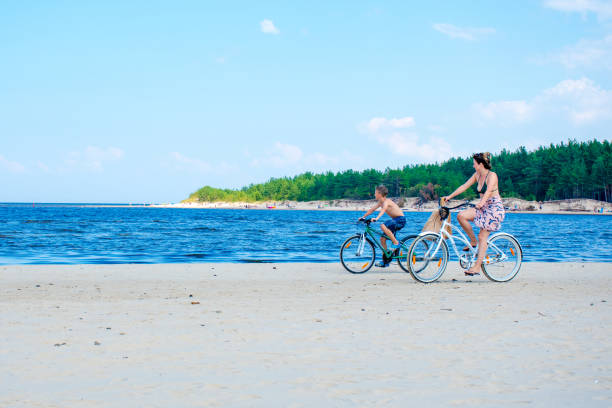 mountain biking on the beach in summer