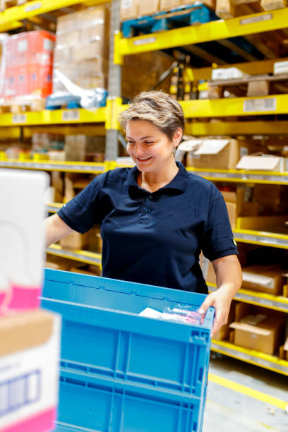 istock Woman carrying full crate 1185836130