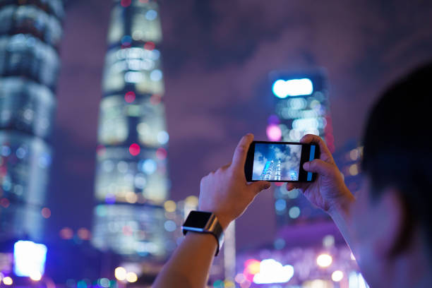 istock young asian man take photo with smart phone 1185836207