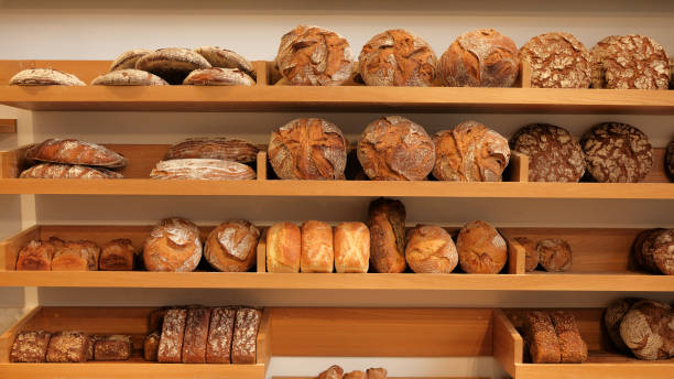 istock Modern bakery with different kinds of bread, cakes and buns 1185836800