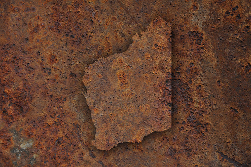 Map of Western Australia on rusty metal