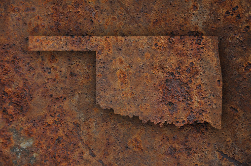 Rusty old boat propeller under the weathered vessel construction, close-up