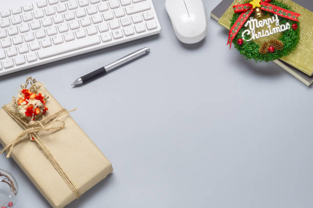 istock Merry Christmas and Happy new years office work space desktop concept. Flat lay top view with keyboard, natural gift box and Christmas ornaments with copy space. 1185838196